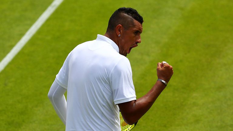 Nick Kyrgios celebrates his first-round victory at Wimbledon