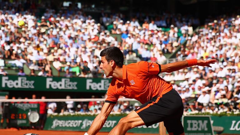 Novak Djokovic of Serbia returns a shot in the Men's Singles Final against Stanislas Wawrinka