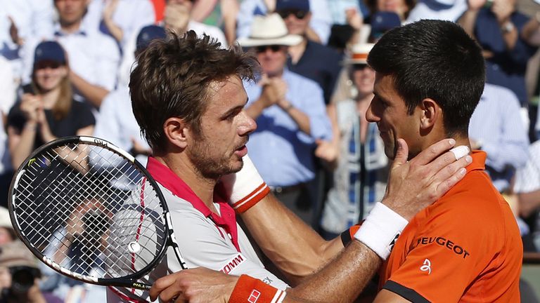 Serbia's Novak Djokovic (R) congratulates Switzerland's Stanislas Wawrinka on winning the men's final match of the Roland Garros 2015 French Tennis Open
