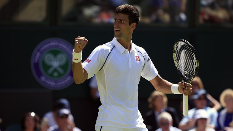 Novak Djokovic celebrates victory over Philipp Kohlschreiber during day one of the Wimbledon Championships at the All England Lawn Tennis and Croquet Club,