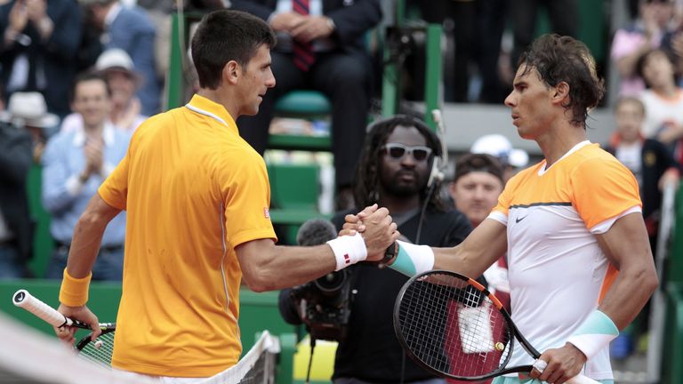 Novak Djokovic shakes hands with Rafael Nadal (R) in Monte Carlo