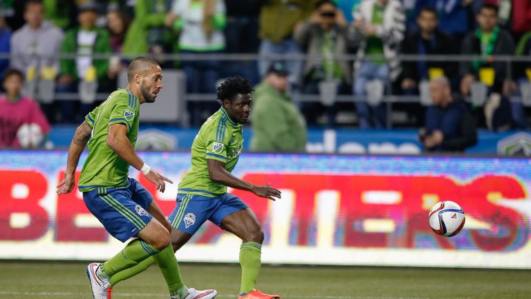 SEATTLE, WA - MARCH 08:  Clint Dempsey #2 and Obafemi Martins #9 of the Seattle Sounders FC in action against the New England Revolution at CenturyLink Fie