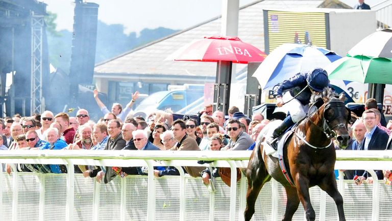 Painted Cliffs and jockey Ryan Moore win the GAIN Railway Stakes during day two of the Irish Derby Festival at the Curragh Racecourse.
