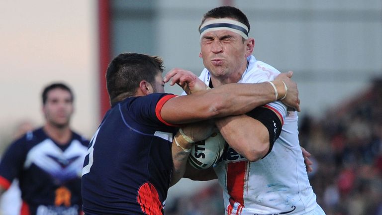 Mathias Pala wraps up England's Kevin Sinfield