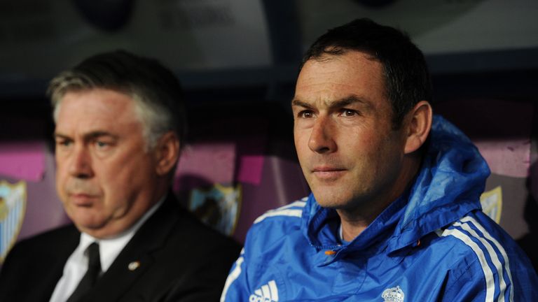 Assistant coach Paul Clement (R) sits beside head coach Carlo Ancelotti of Real Madrid FC during the La Liga match between Malag
