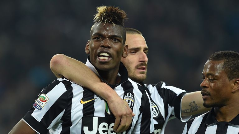 Paul Pogba (L) of Juventus FC celebrates after scoring the opening goal during the Serie A match between Juventus FC and US Sassu