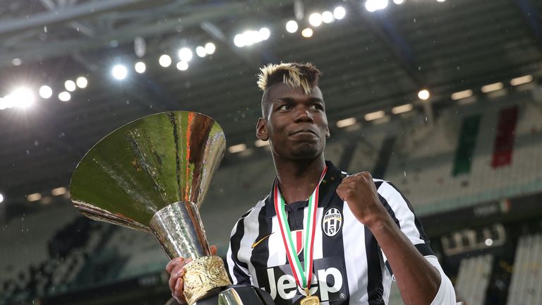Juventus' midfielder from France Paul Pogba celebrates with the Italian League's trophy