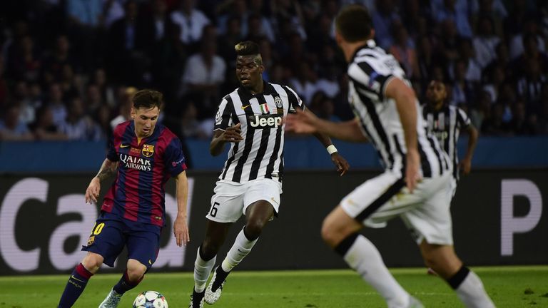 Juventus midfielder Paul Pogba (C) and Barcelona's Argentinian forward Lionel Messi (L) vie for the ball during the UEFA Champions League Final