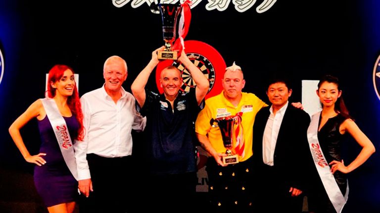 Phil Taylor celebrates his Japan Darts Masters success