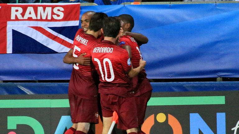 Portugal's players celebrate scoring during the UEFA Under21 European Championship 2015 football match between England and Portugal