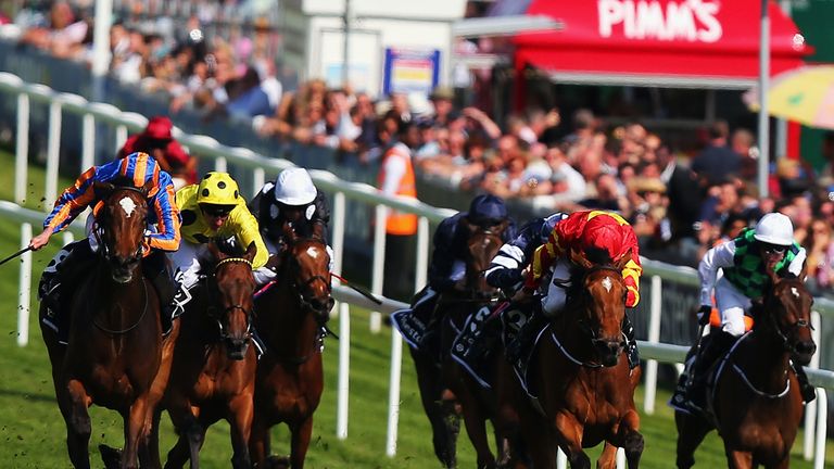 EPSOM, ENGLAND - JUNE 05:  Colm O'Donoghue riding Qualify leads the field to victory in The Investec Oaks races during the Investec Ladies Day at Epsom Rac