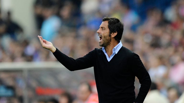 Quique Sanchez Flores gestures during a Spanish League football match between Atletico Madrid and Barcelona at Vicente Calderon in 2010.