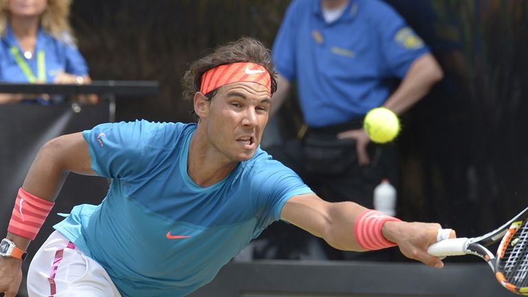 Spains's Rafael Nadal returns the ball to Australia's Bernard Tomic during their quarterfinal match at the ATP 