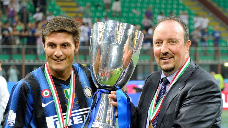 Head Coach Rafael Benitez and Javier Zanetti of FC Internazionale Milano celebrate with the trophy after winning the Supercoppa 