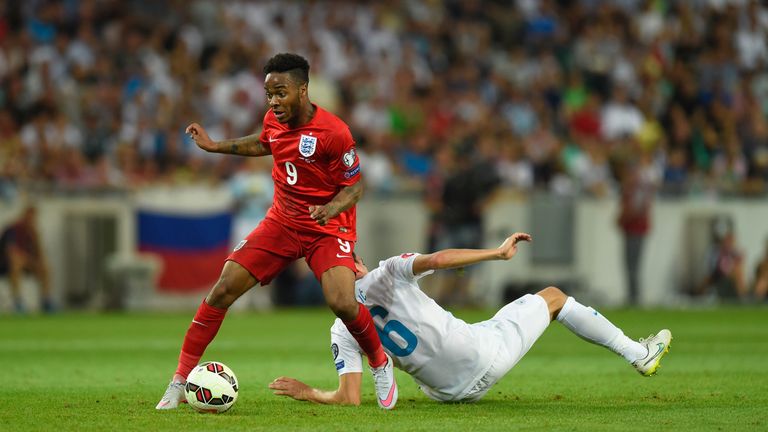 England player Raheem Sterling skips past Branko Ilic of Slovenia during the UEFA EURO 2016 Qualifier