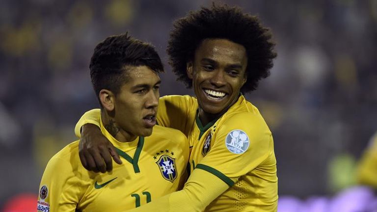 Willian (right) celebrates Brazil's second goal with Roberto Firmino.