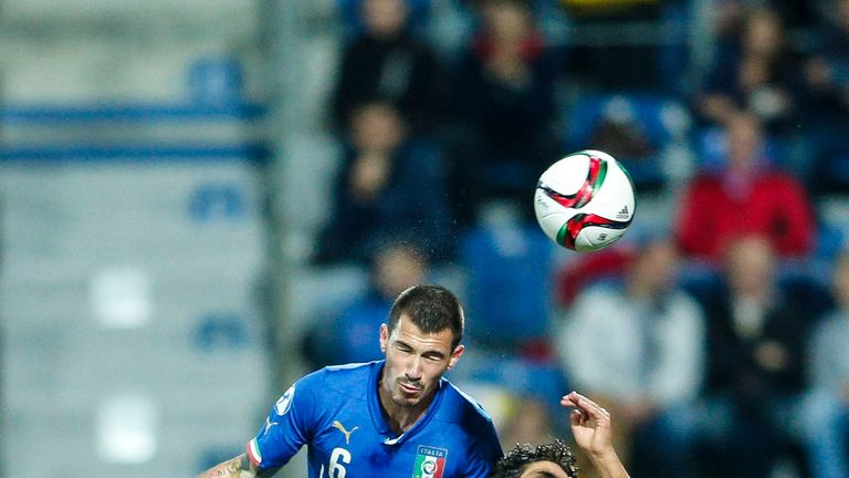 Alessio Romagnoli jumps for a header against Portugal Under-21s