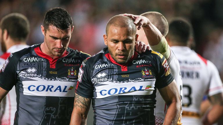 Wigan's Matty Bowen (R) is consoled by Matty Smith (L) after gifting St Helens a try