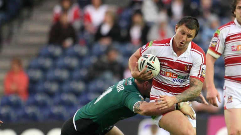 Wigan's Tim Smith is tackled by St Helens' Lee Gilmour 2009