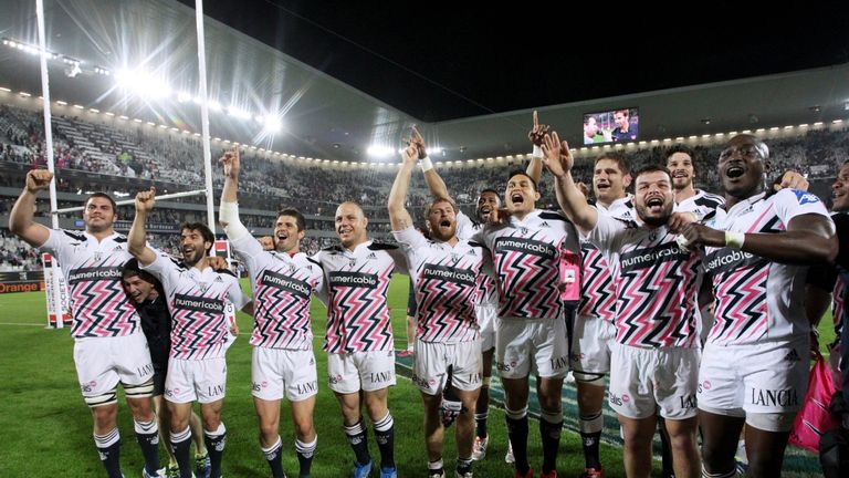 Stade Francais' players celebrate after their win over Toulon