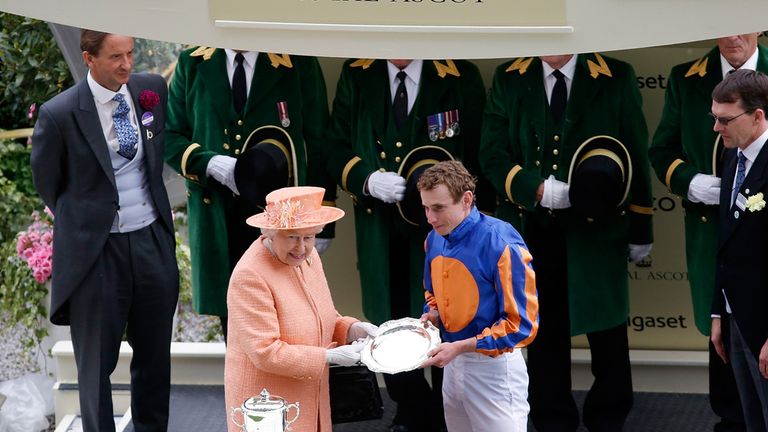 ASCOT, ENGLAND - JUNE 20:  Queen Elizabeth II presents Ryan Moore with the Leading Jockey award  during day 5 of Royal Ascot 2015 at Ascot racecourse on Ju