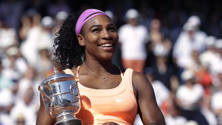 US Serena Williams celebrates with the trophy following her victory over Czech Republic's Lucie Safarova