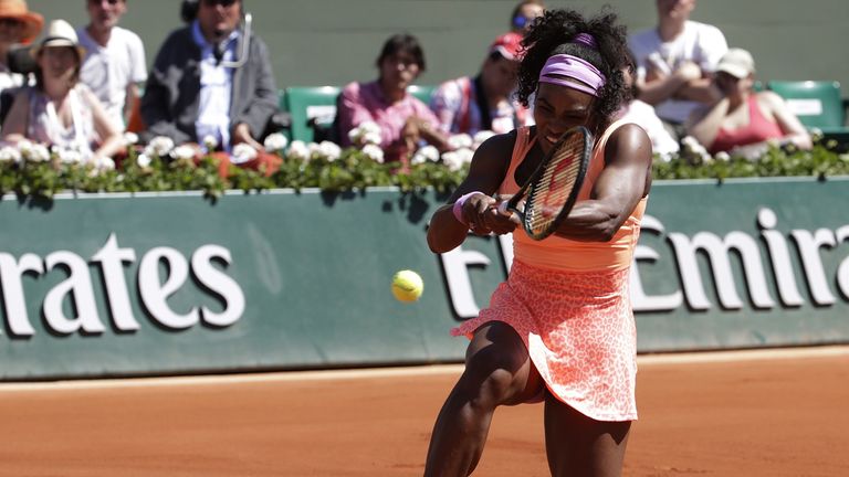 Serena Williams returns the ball
