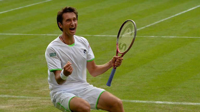 Ukraine's Sergiy Stakhovsky celebrates beating Switzerland's Roger Federer in their second round men's singles match on day three of the 2013 Wimble