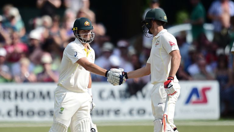 Shane Watson (left) is congratulated by team -mate Mitchell Marsh after scoring a half century