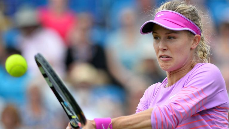Eugenie Bouchard returns the ball to Alison Riske at the WTA Eastbourne International tennis tournament