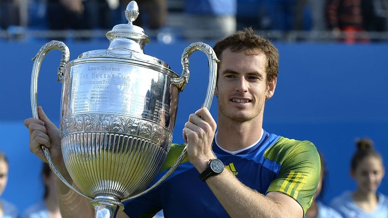 Andy Murray poses with the trophy after winning the ATP Aegon Championships final in 2013