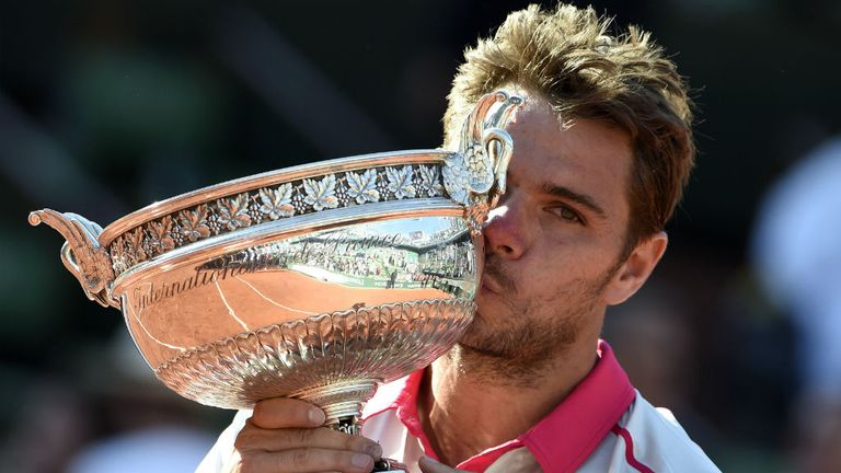 Stan Wawrinka kisses the trophy following his victory over Novak Djokovic at the 2015 French Open