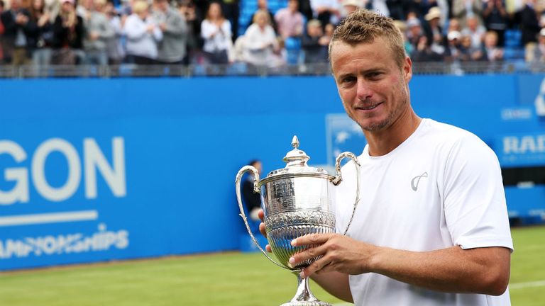 Lleyton Hewitt poses with a trophy after his last match at Queen's Club having lost to Kevin Anderson