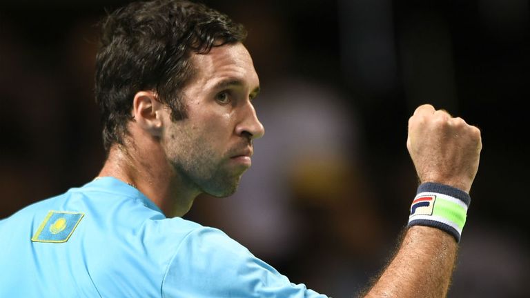 Kazakhstan's Mikhail Kukushkin reacts after winning his first set against Stan Wawrinka in the Davis Cup