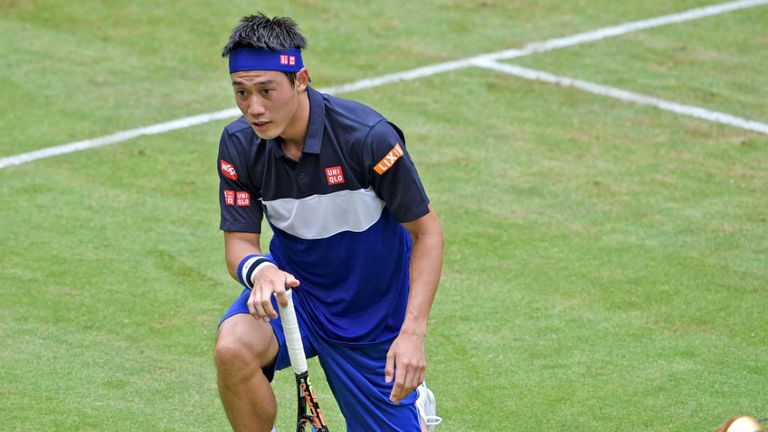 Kei Nishikori reacts in his match against Jerzy Janowicz at the Gerry Weber Open