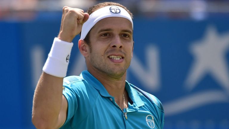Luxembourg's Gilles Muller reacts after winning his match against Bulgaria's Grigor Dimitrov at Queen's Club