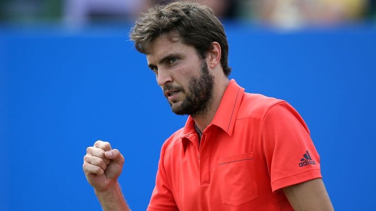 Gilles Simon celebrates victory over Joao Sousa at the Aegon Open in Nottingham
