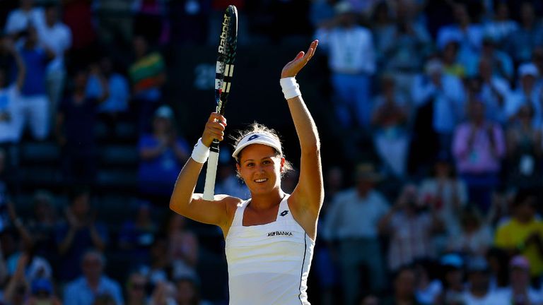 Jana Cepelova celebrates winning her match against Simona Halep at Wimbledon