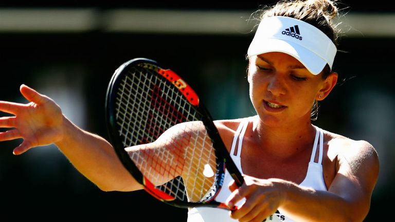 Simona Halep reacts in her Ladies Singles first round match against Jana Cepelova during Wimbledon