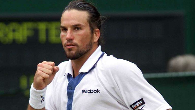 Patrick Rafter celebrates winning the first set from Andre Agassi during the semi-finals at Wimbledon