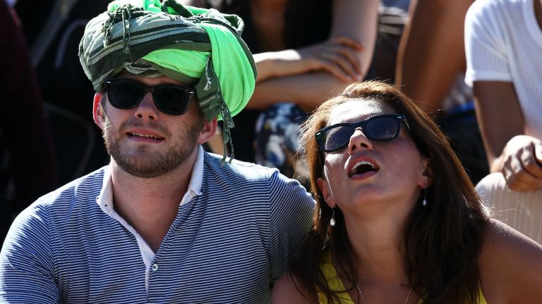 Spectators enjoy the hot weather during day two of Wimbledon