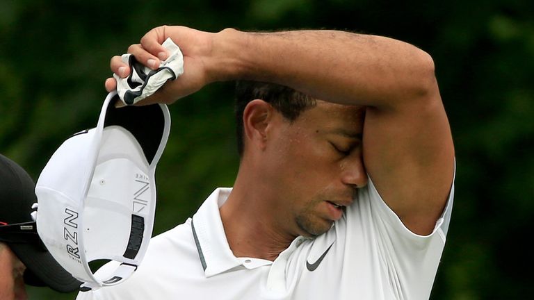 DUBLIN, OH - JUNE 04:  Tiger Woods wipes his face after his tee shot on the 14th hole during the first round of The Memorial Tournament presented by Nation