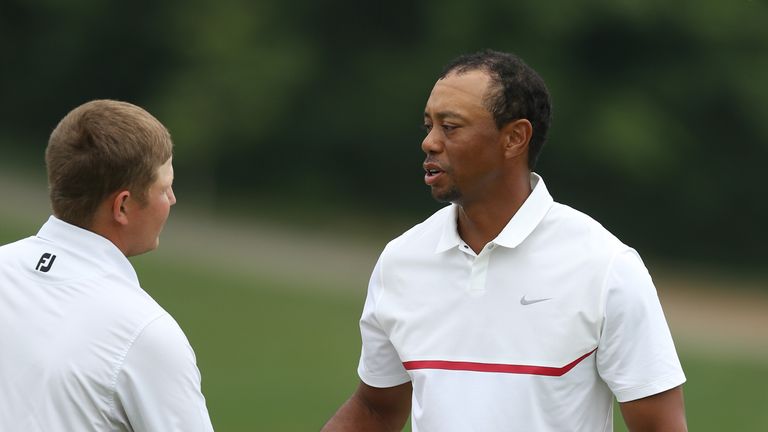 Tiger Woods shakes hands with Zac Blair, who outscored the five-time champion by 15 shots