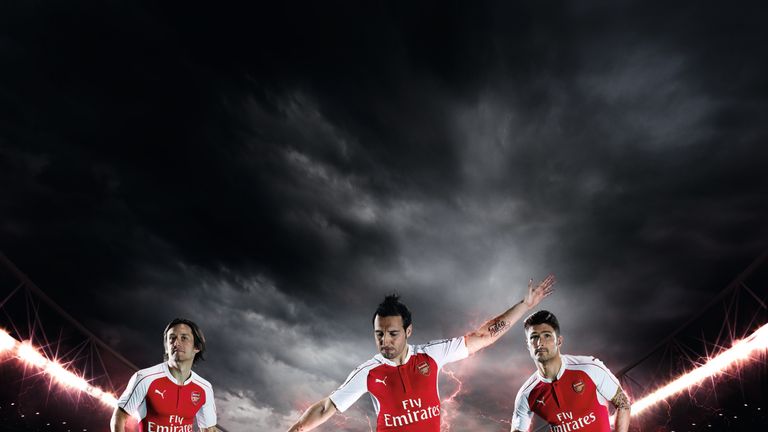 Tomas Rosicky (L), Santi Cazorla (C) and Olivier Giroud (R) model Arsenal's new PUMA home kit.