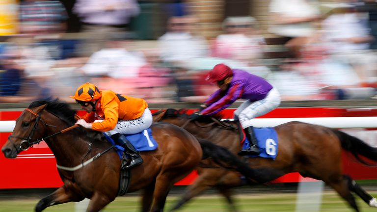 SALISBURY, ENGLAND - JUNE 24: Robert Winston riding Twin Sails win The New Forest Farm Machinery/John Deere Auction Sales at Salisbury racecourse.