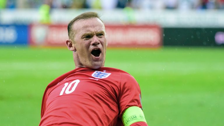 England's Wayne Rooney celebrates after scoring a goal during the Euro 2016 qualifying football match between Slovenia and England.