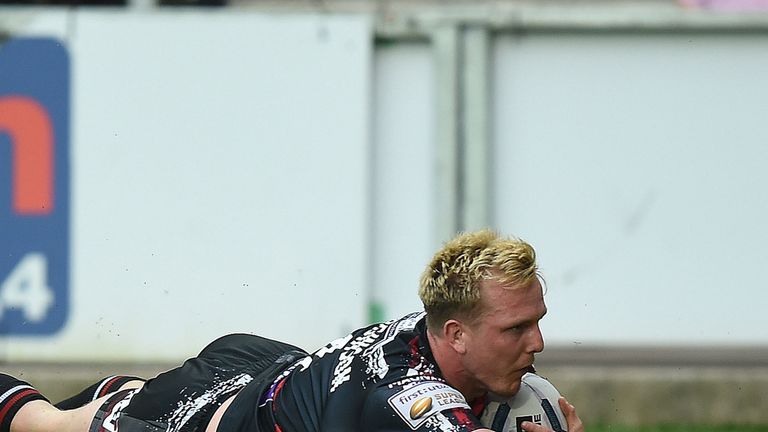 Wigan Warriors Dan Sarginson goes over for a try against St Helens