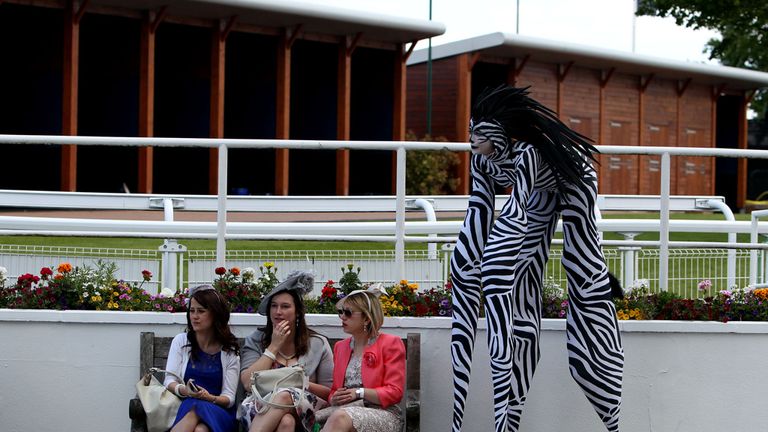 A performer on stilts during Derby Day