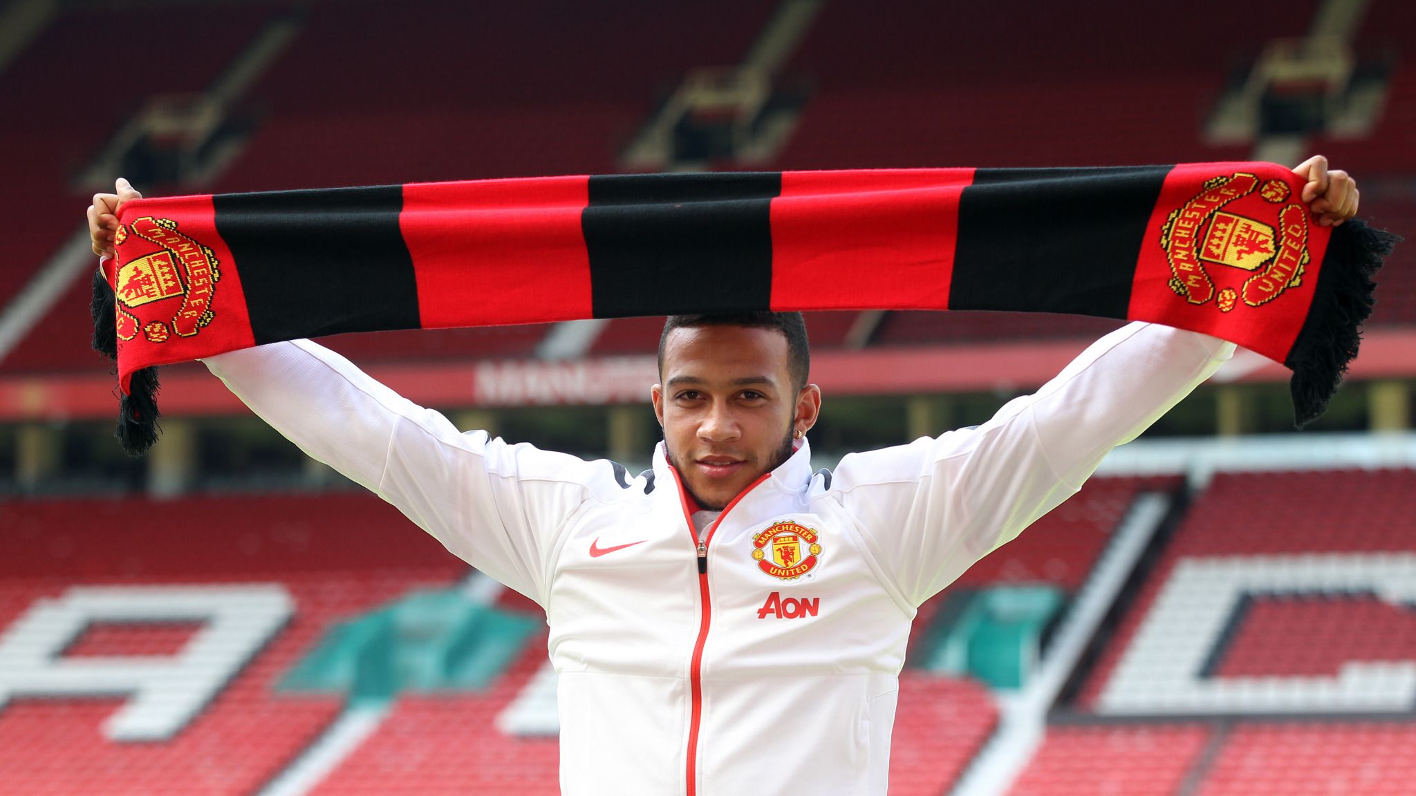 Manchester United winger Memphis Depay poses with Sweg Board during  photoshoot