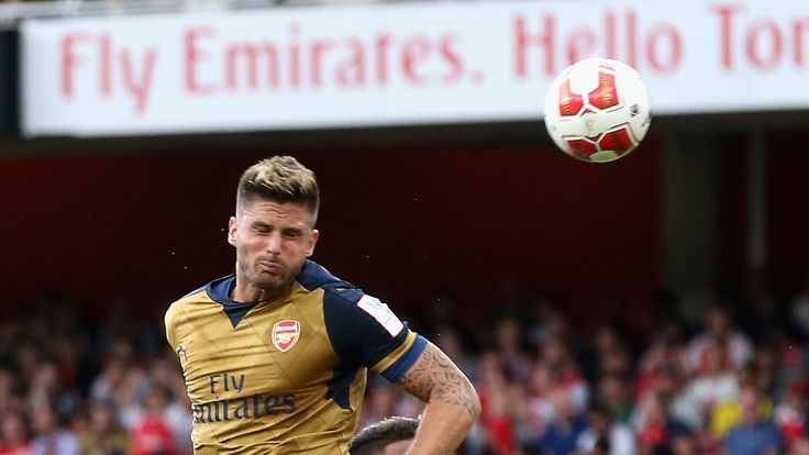 Olivier Giroud of Arsenal heads the first goal during the Emirates Cup match between Arsenal and Lyon